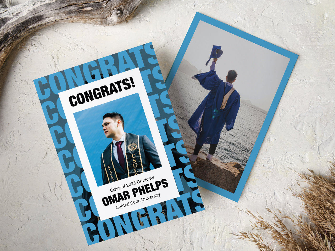 This custom graduation announcement card is set against a natural, neutral background with driftwood accents. The front design features bold, modern typography, layered over a repeated pattern of CONGRATS in a sleek blue and black theme. A personalized graduate photo is framed in white, displaying the student’s name, graduation year, and university. The back of the card is also customizable with a graduate image. Ideal for senior graduation announcements, high school seniors, or college grads.