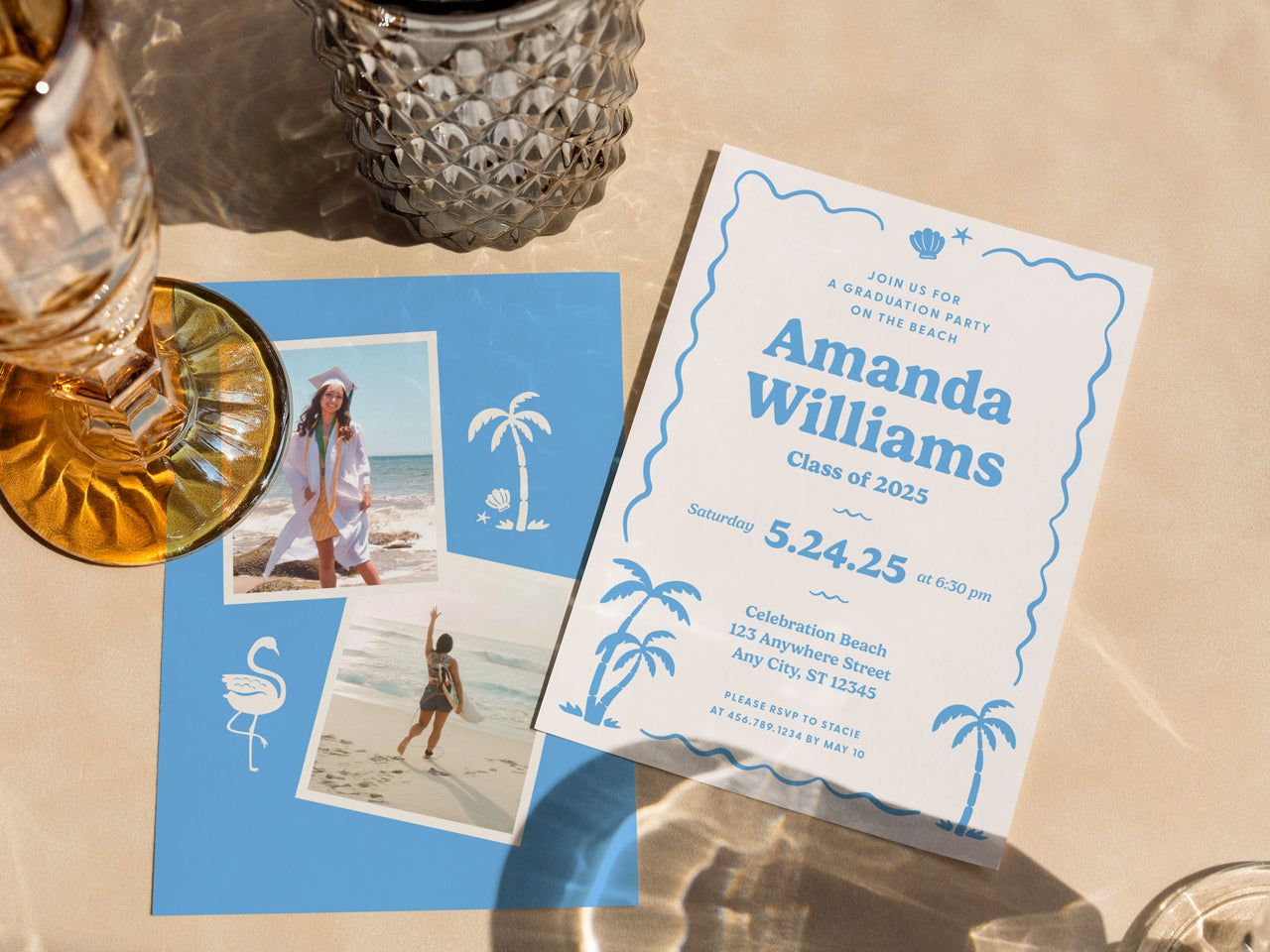 A flat lay of a retro beach-themed graduation invitation set styled on a neutral-toned surface with glassware in the background. The printed invite has a wavy border and coastal illustrations, while the blue photo collage backer adds a fun, nostalgic touch. The invitations are printed on premium white cotton cardstock, making them ideal for a tropical, modern, or boho grad party theme. A unique, stylish way to announce a Class of 2025 celebration.