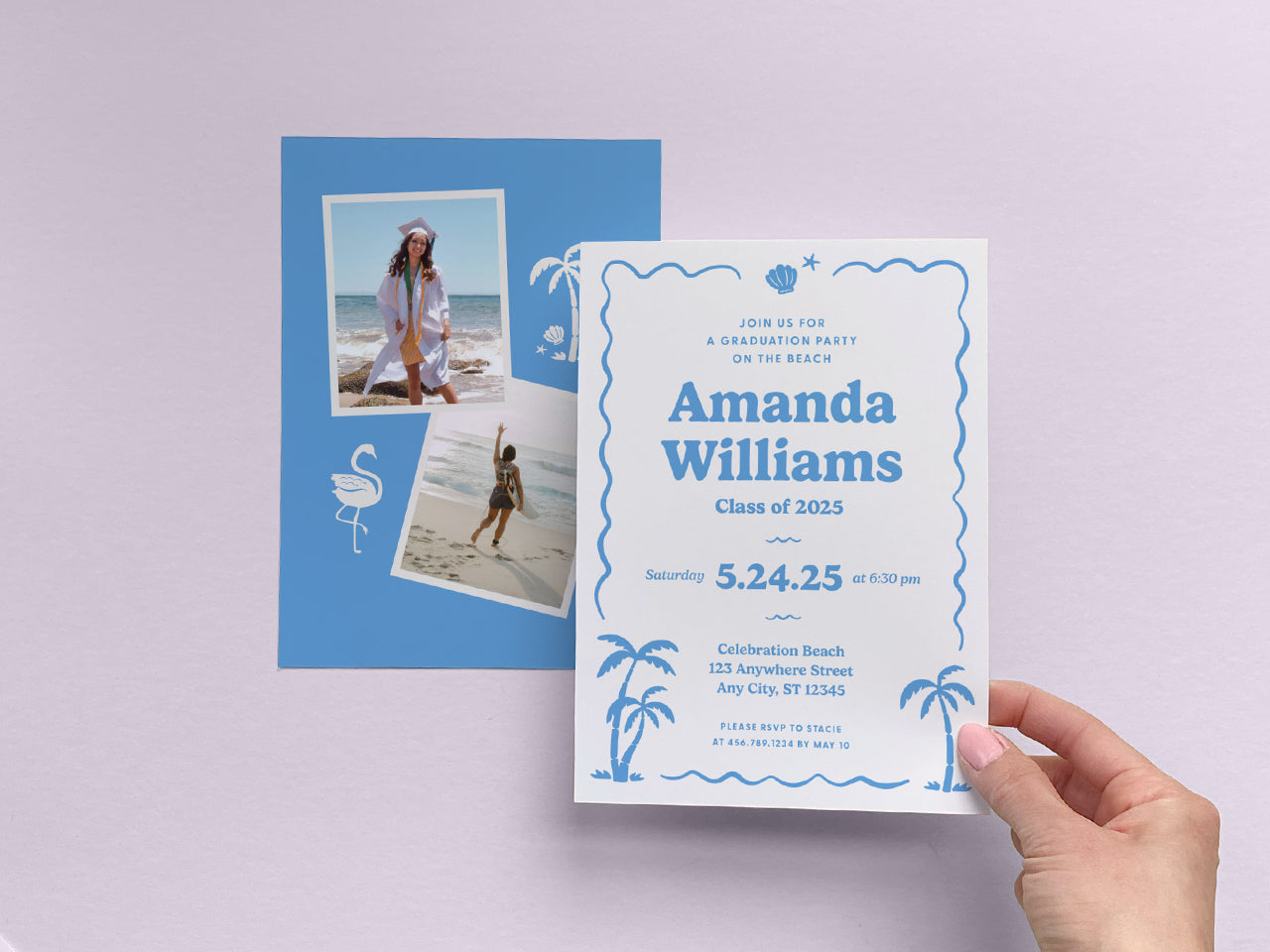 A minimalist, well-lit shot of a hand holding a printed retro beach graduation invitation against a soft lavender neutral background. The design features a vintage coastal aesthetic with a blue wavy border, palm tree accents, and bold typography. The coordinating blue photo collage backer complements the set, making it ideal for a stylish, tropical-inspired graduation announcement. Printed on white cotton cover stock for a premium feel.