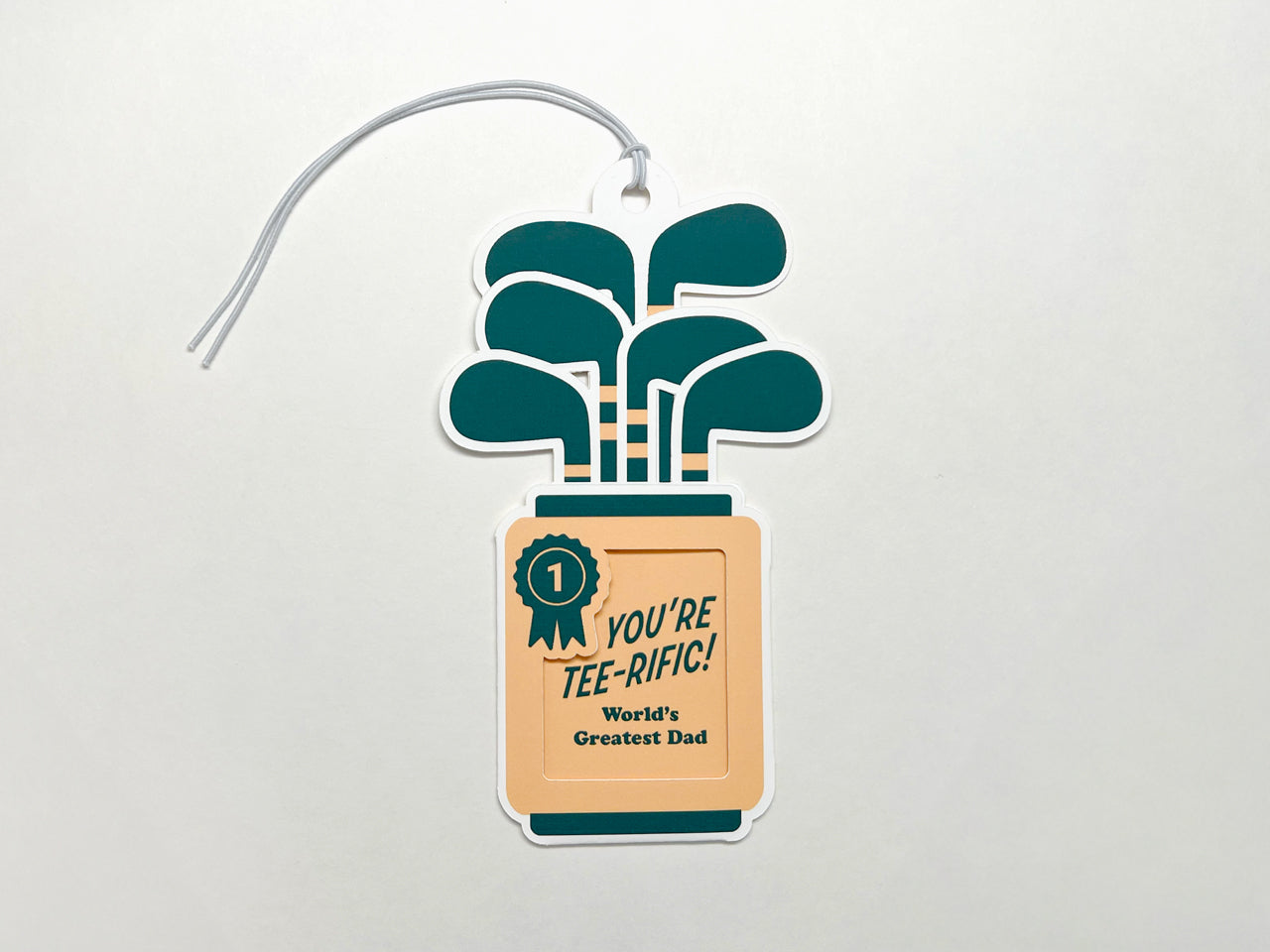 Golf-themed Father's Day gift tag with an off-white elastic string attached.