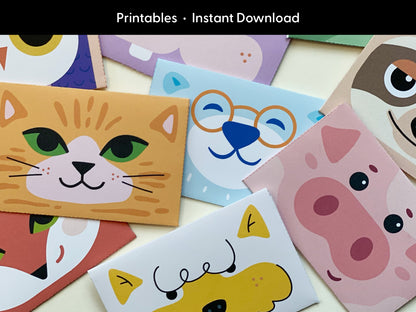 A close-up of printable animal gift card holders showcases a variety of animal faces including a smiling cat, a blue bear wearing glasses, a pink pig, a fox, a dog, and a sloth. The designs are bright and playful, featuring bold colors and simple shapes that appeal to kids and animal lovers. The animal card holders are designed for cutting and folding, making them an ideal printable for adding a personal, creative touch to gift cards for birthdays, holidays, and celebrations.