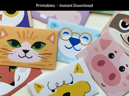 A close-up of printable animal gift card holders showcases a variety of animal faces including a smiling cat, a blue bear wearing glasses, a pink pig, a fox, a dog, and a sloth. The designs are bright and playful, featuring bold colors and simple shapes that appeal to kids and animal lovers. The animal card holders are designed for cutting and folding, making them an ideal printable for adding a personal, creative touch to gift cards for birthdays, holidays, and celebrations.