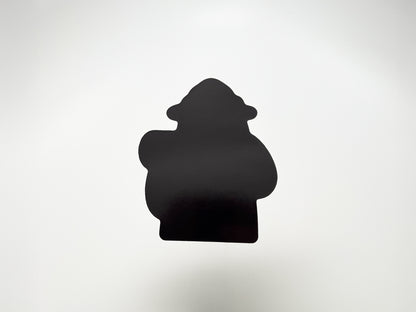 Back view of a handmade die-cut fridge magnet shaped like a cartoon bear camper. The solid black magnet silhouette highlights its custom cut design and durable finish. Perfect quirky fridge magnet gift for campers, hikers, and outdoor lovers, made to stick securely on any magnetic surface.