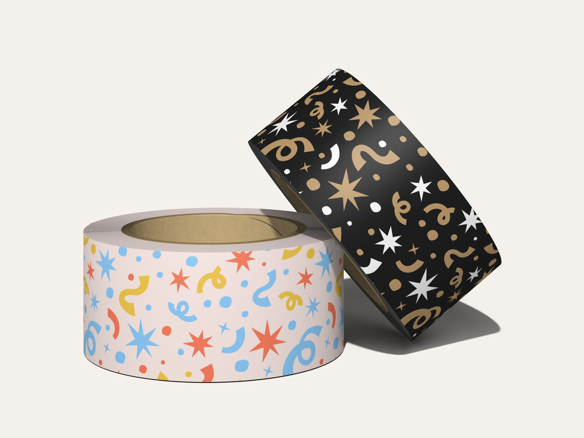 Two tape rolls featuring a seamless confetti pattern with starbursts, streamers, and dots in two colorways: blue, coral, and yellow on blush, and gold and white on black.