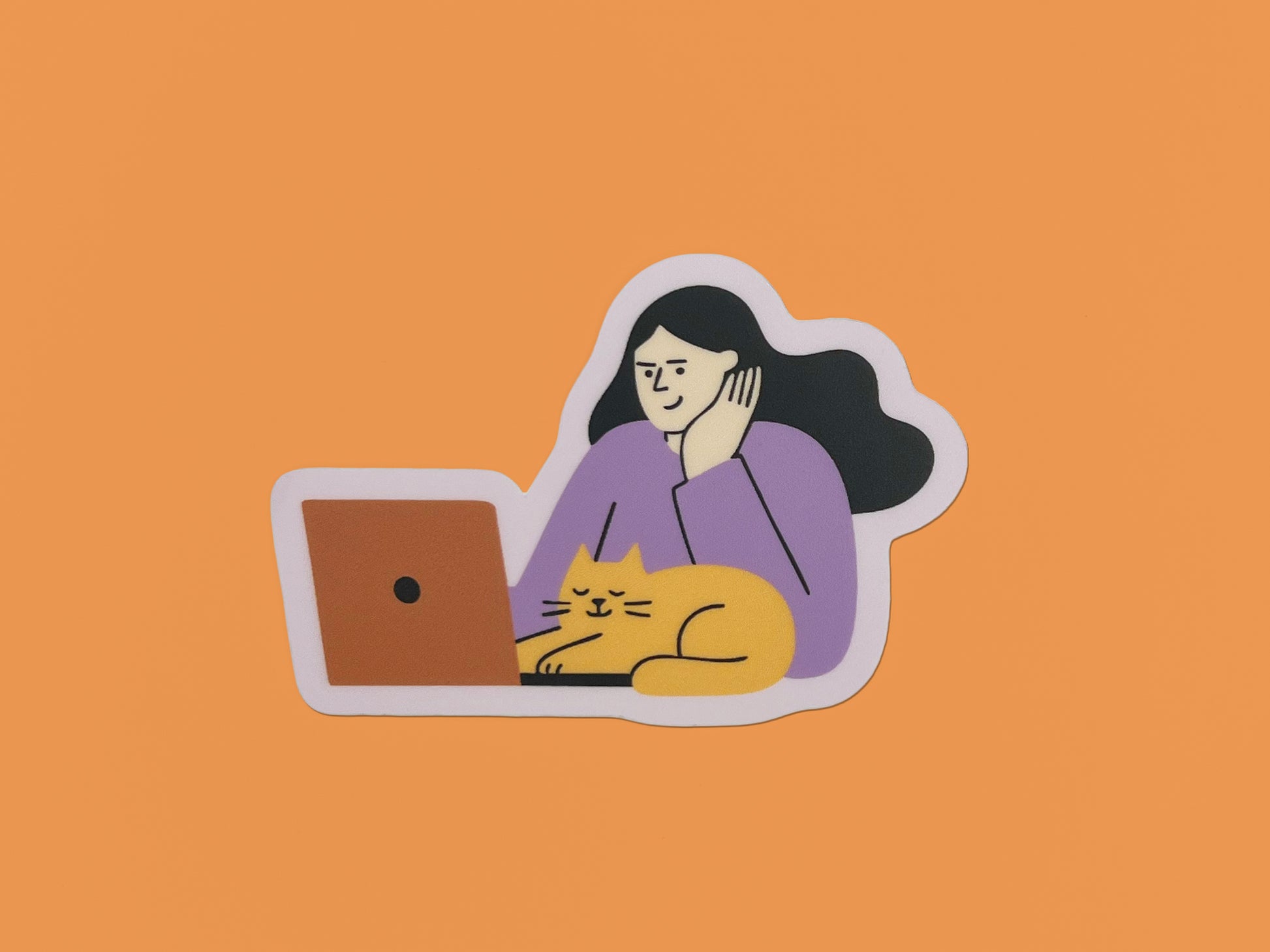 Matte vinyl die-cut sticker on an orange background showing an illustration of a person with long dark hair wearing a lavender top, resting their head on one hand while looking at an orange laptop. A relaxed yellow cat with closed eyes is lying in front of the laptop. The sticker has a soft lavender border around the illustration.