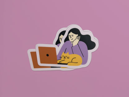 Three matte vinyl die-cut stickers stacked slightly offset on a pink background. Each sticker shows an illustration of a person with long dark hair wearing a lavender top, resting their head on one hand while looking at an orange laptop. A relaxed yellow cat with closed eyes is lying in front of the laptop. The stickers have a soft lavender border around the illustration.