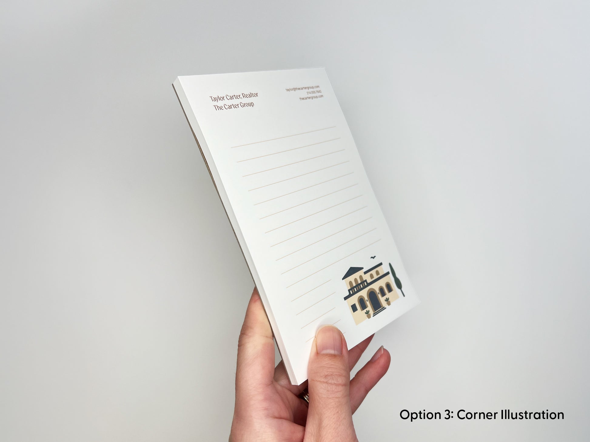 Hand holding personalized 4x6 real estate notepad in corner illustration layout, featuring custom realtor contact branding, lined writing space, and thick paper stack for client gifts and marketing.