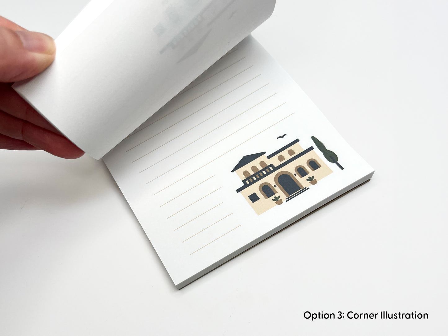 Close-up of personalized 4x6 real estate notepad in corner illustration layout, showing lined writing space and Mediterranean-style home artwork as a custom realtor marketing pad.