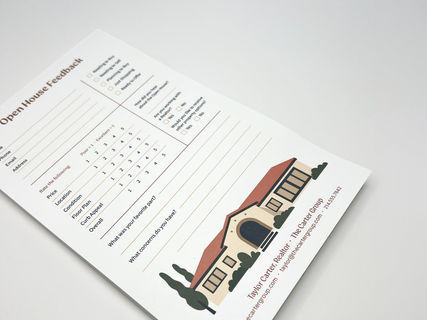 Angled view of a custom 5 × 8 Open House Feedback real estate notepad displaying structured buyer feedback fields, rating scales for property features, open comment sections, and a customizable branded footer with agent contact details and illustrated home graphic.