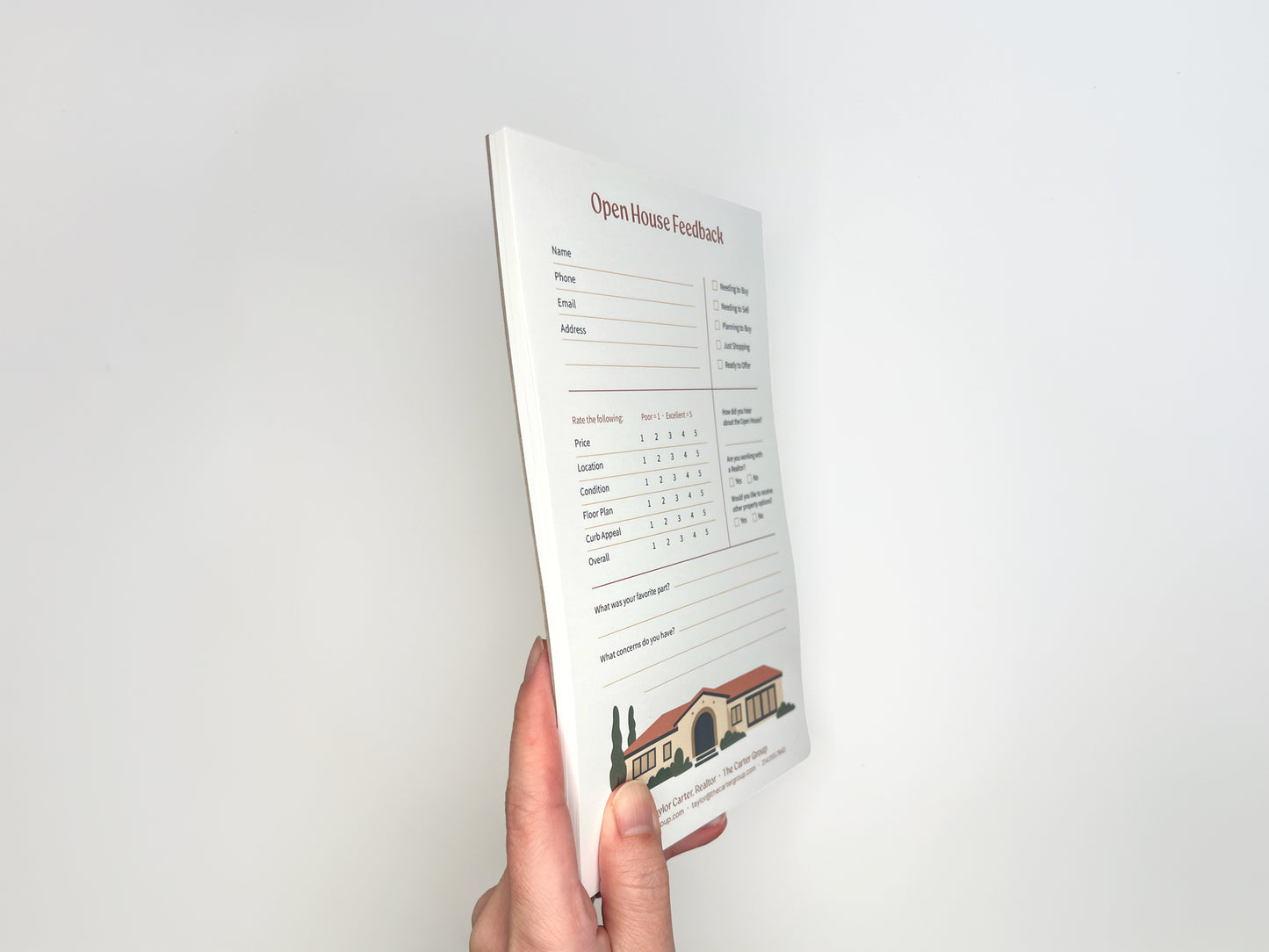Side view of a hand holding a custom 5 × 8 Open House Feedback real estate notepad showing stacked tear-off sheets, structured buyer feedback layout, rating scales, and customizable branded footer designed for real estate open house follow-up.