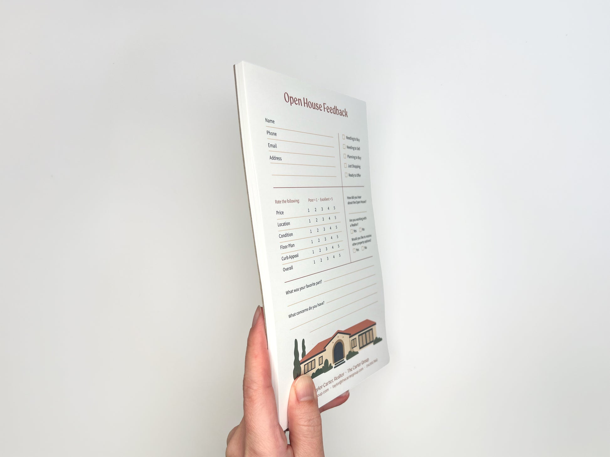 Side view of a hand holding a custom 5 × 8 Open House Feedback real estate notepad showing stacked tear-off sheets, structured buyer feedback layout, rating scales, and customizable branded footer designed for real estate open house follow-up.
