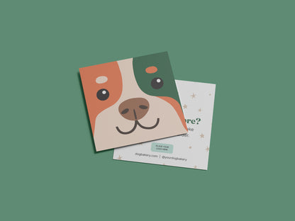 Square dog bakery reorder card template featuring an orange, green, and cream illustrated dog face layered over an editable reorder card with space for a logo, website, and social handle.