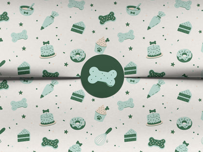 Seamless dog bakery pattern in the white colorway, shown on folded tissue paper sealed with a round dark green sticker featuring a mint bone-shaped cookie. The repeating design shows bone cookies, bone-topped cakes, paw-print cupcakes, cake slices, donuts, piping bags, treat bowls, whisks, and stars in mint and dark green.
