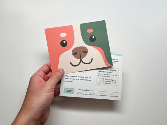 Dog bakery thank you card template featuring a colorful illustrated dog face and editable reorder and business information.