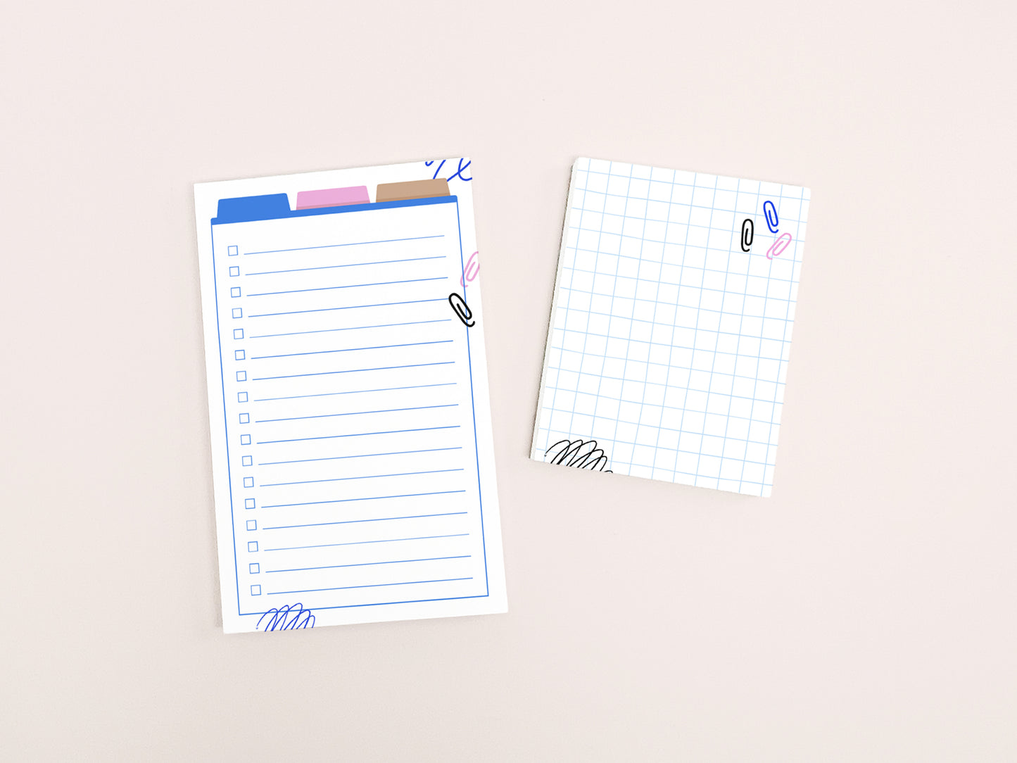 A lined checklist notepad and a small grid notepad with colorful office-themed illustrations displayed side by side on a light background.