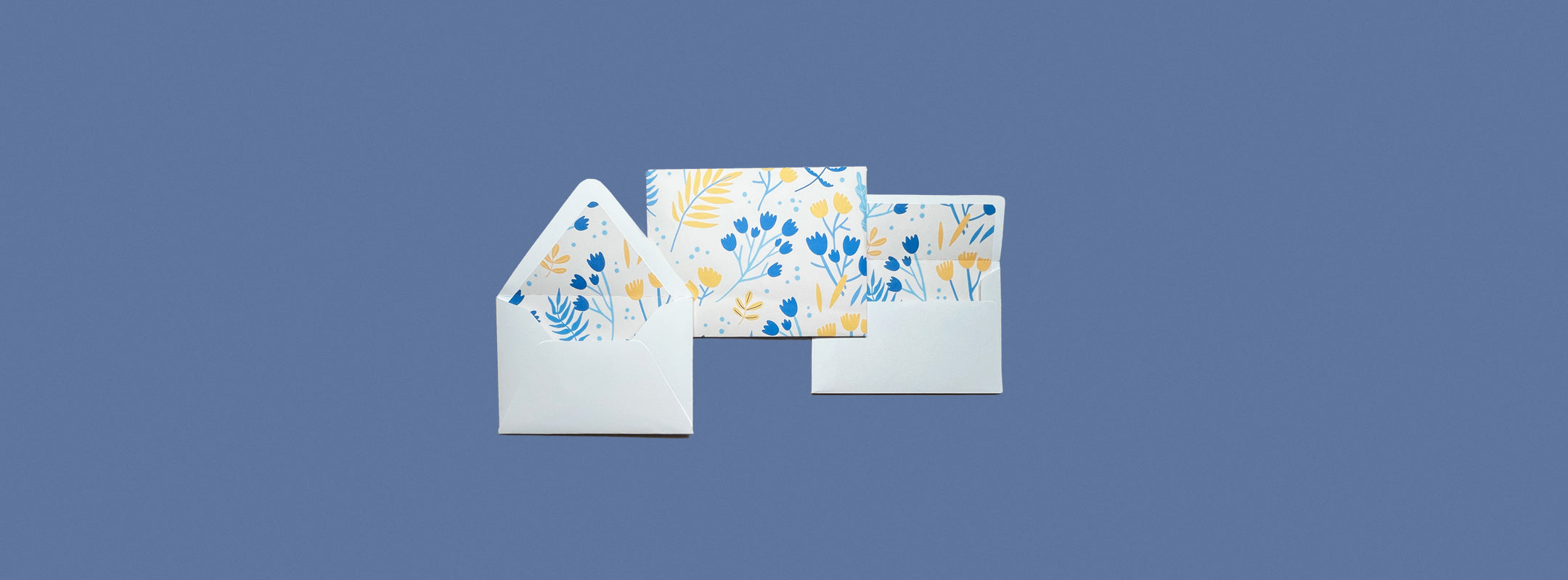Printable envelope and liner template featuring a modern floral design in blue and yellow. DIY stationery for invitations, letters, and special occasions. Perfect for crafting personalized envelopes at home.