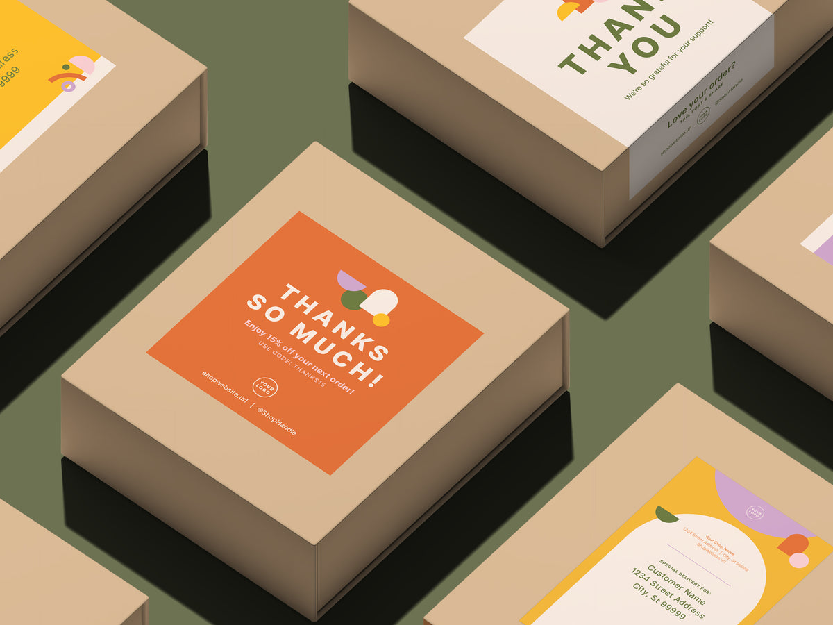 A set of kraft paper product boxes arranged on a muted green background, each featuring colorful printed thank-you and shipping labels on top and sides. The central box shows an orange label reading “THANKS SO MUCH!” in off-white text.
