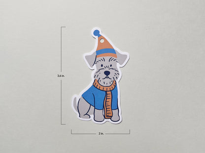 Illustrated Schnauzer gift tag featuring a dog in a winter hat and scarf, shown with dimensions. The die-cut tag measures 3.6 inches tall and 2 inches wide, making it ideal for dog lover presents and holiday gift embellishments.