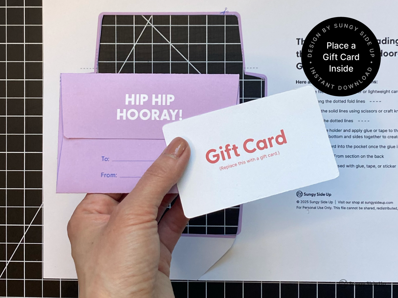 Person holding a printable hippo gift card holder and inserting a sample gift card inside. This DIY envelope is designed for birthday gifts, party favors, and kids celebrations. The digital download includes a PDF template for printing at home. Ideal for shoppers looking for fun and easy paper crafts or printable gift wrapping ideas for children and families.