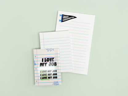 Funny coworker gift bundle featuring an I Love My Job magnet, mini lined notepad, and Chaos Coordinator notepad displayed on a light green background.