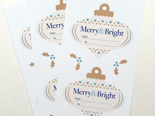 Close up of ivory gift labels with accents of blue and gold.