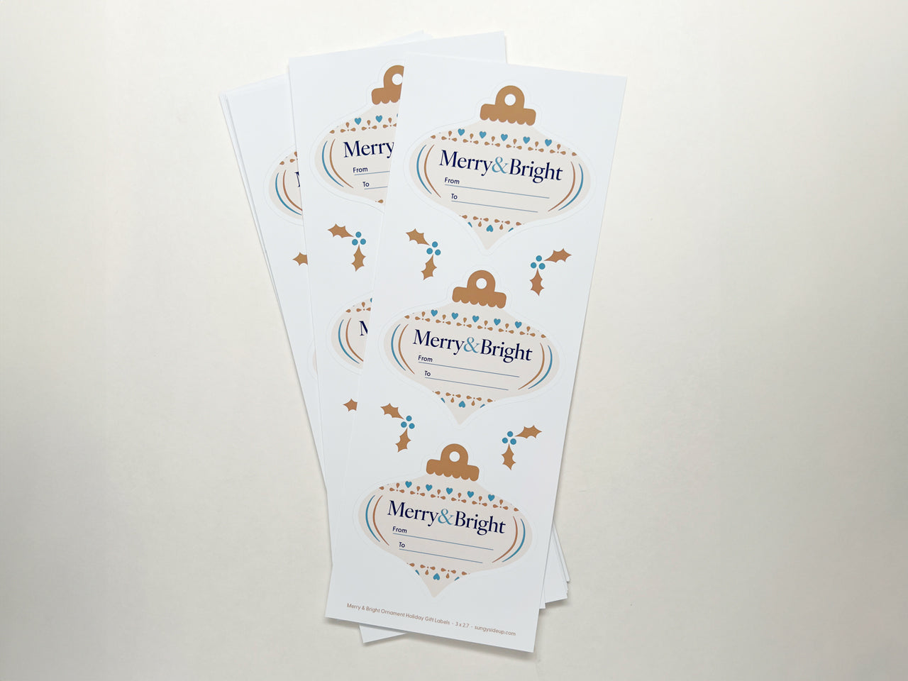 Sheets of gift labels with "Merry & Bright" on the design.