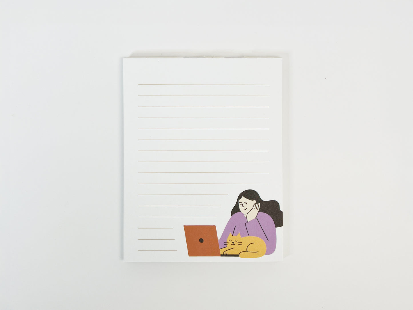 A small lined notepad on a white background featuring a minimalist illustration of a woman working on a laptop with an orange cat resting beside her, designed as a cute work-from-home cat notepad.