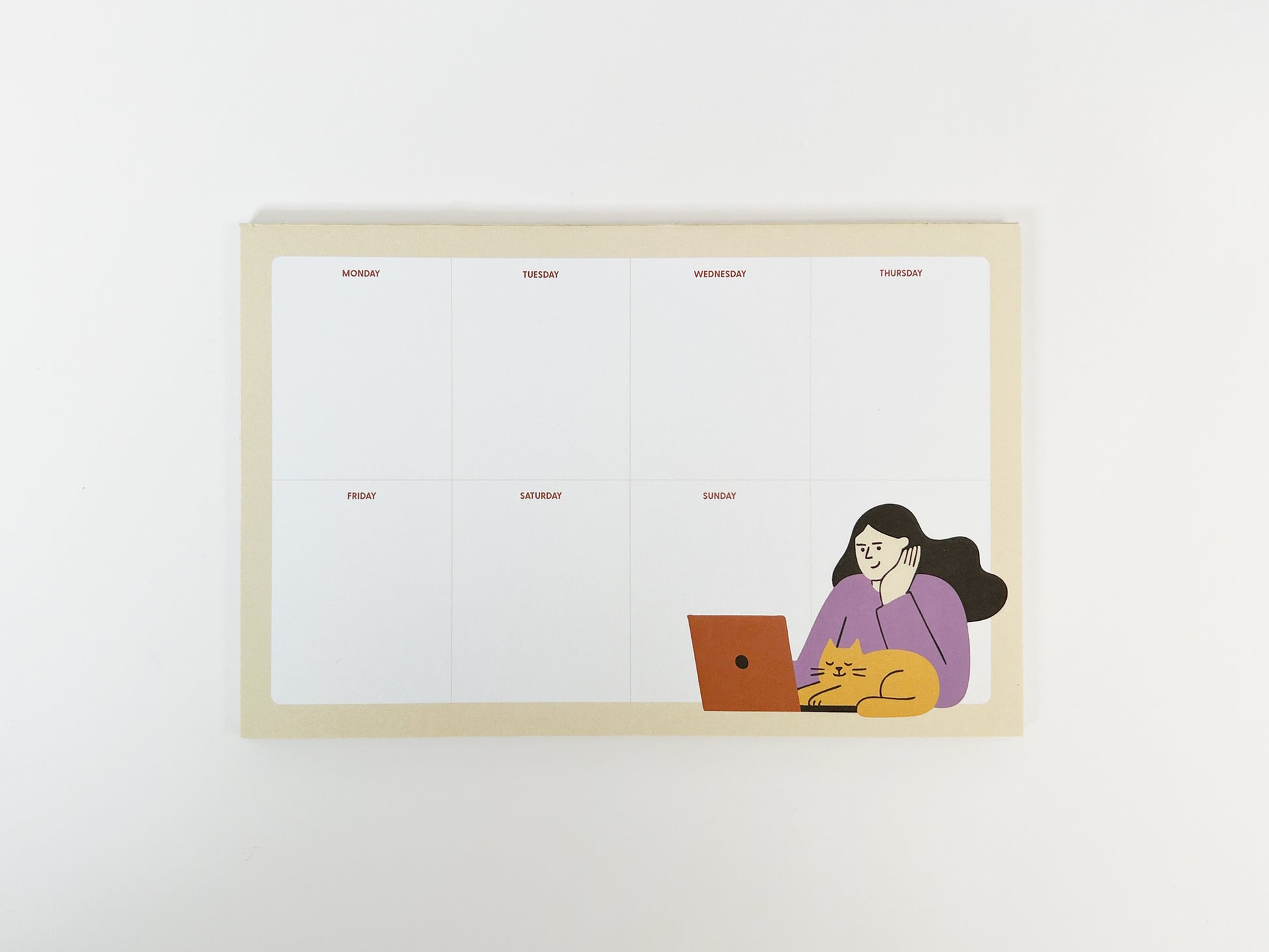 A flat lay photo of an 8.5 x 5.5 inch weekly planner notepad on a white background, featuring an undated Monday–Sunday layout with clean sections, a soft beige border, and a playful illustration in the bottom right of a woman working on a laptop while a yellow cat naps beside her, leaving ample blank space for weekly planning.