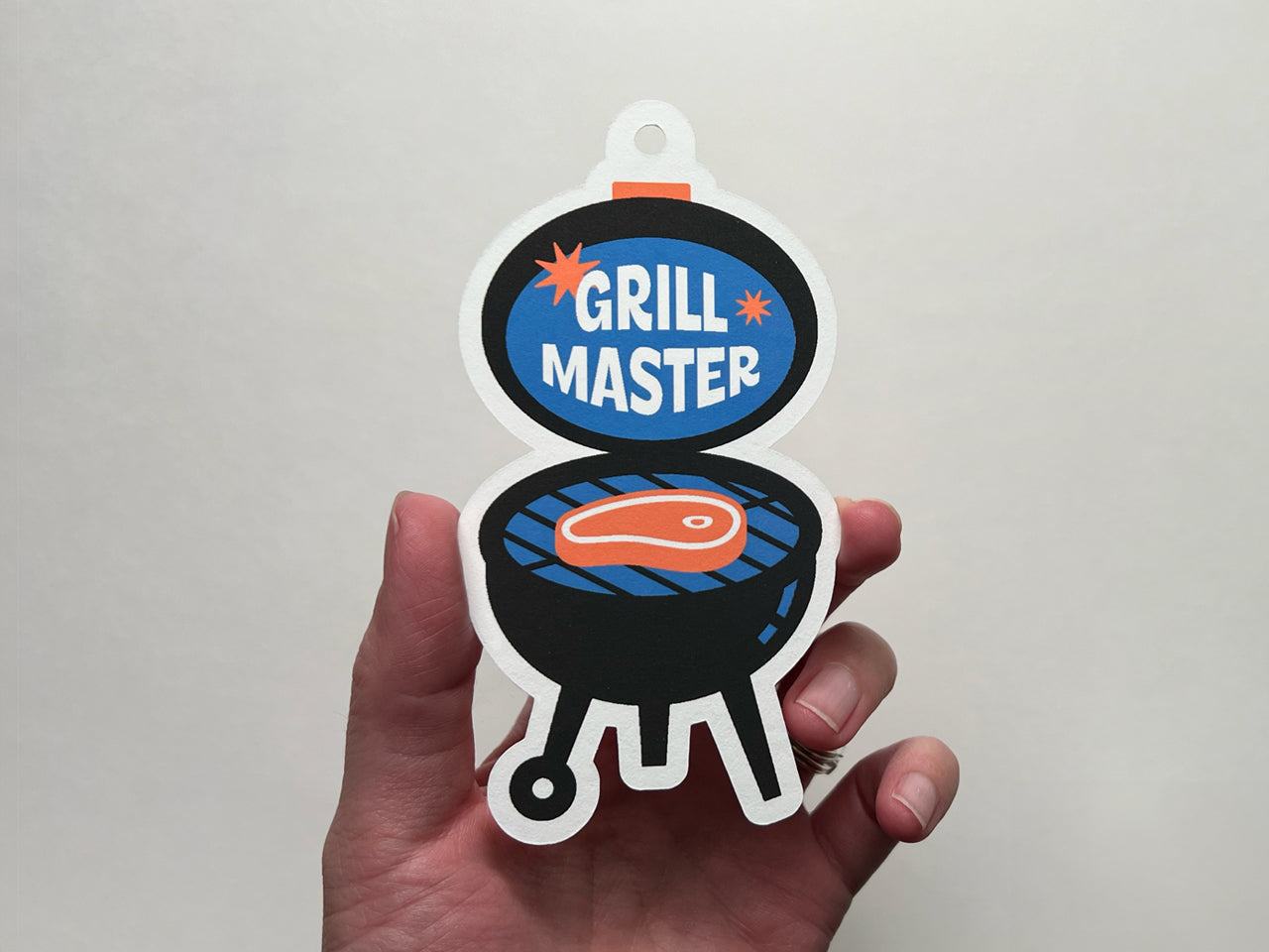 Grill illustration with text, "Grill Master" as a gift tag for Father's Day.