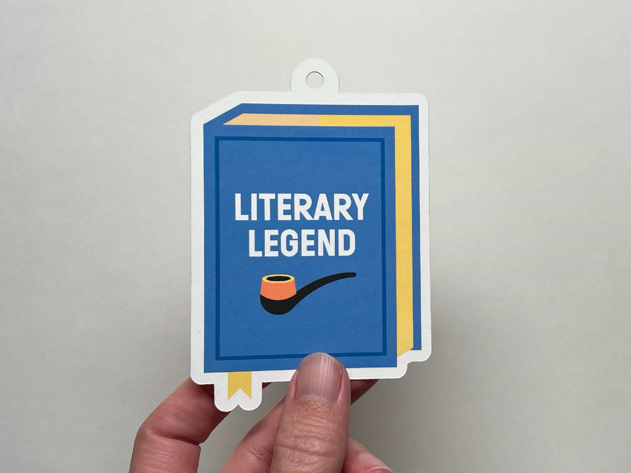 Book illustration with text, "Literary Legend" as a gift tag for Father's Day.