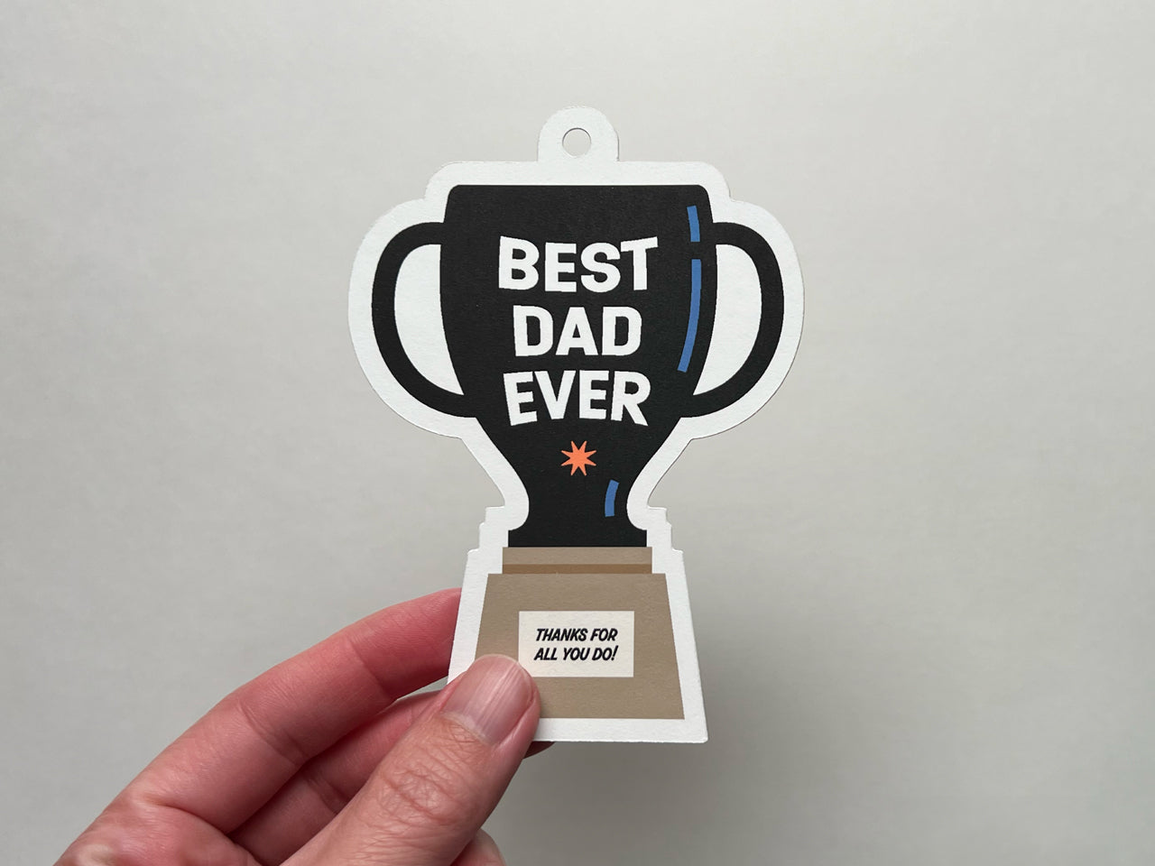 Trophy illustration with text, "Best Dad Ever" as a gift tag for Father's Day.