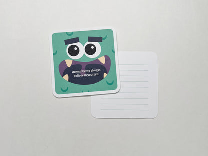 A single green monster-themed note card with a fun cartoon face and a motivational message. The card is square-shaped with round corners and paired with a lined back for parents to write in own message. Both cards are set on a white background.