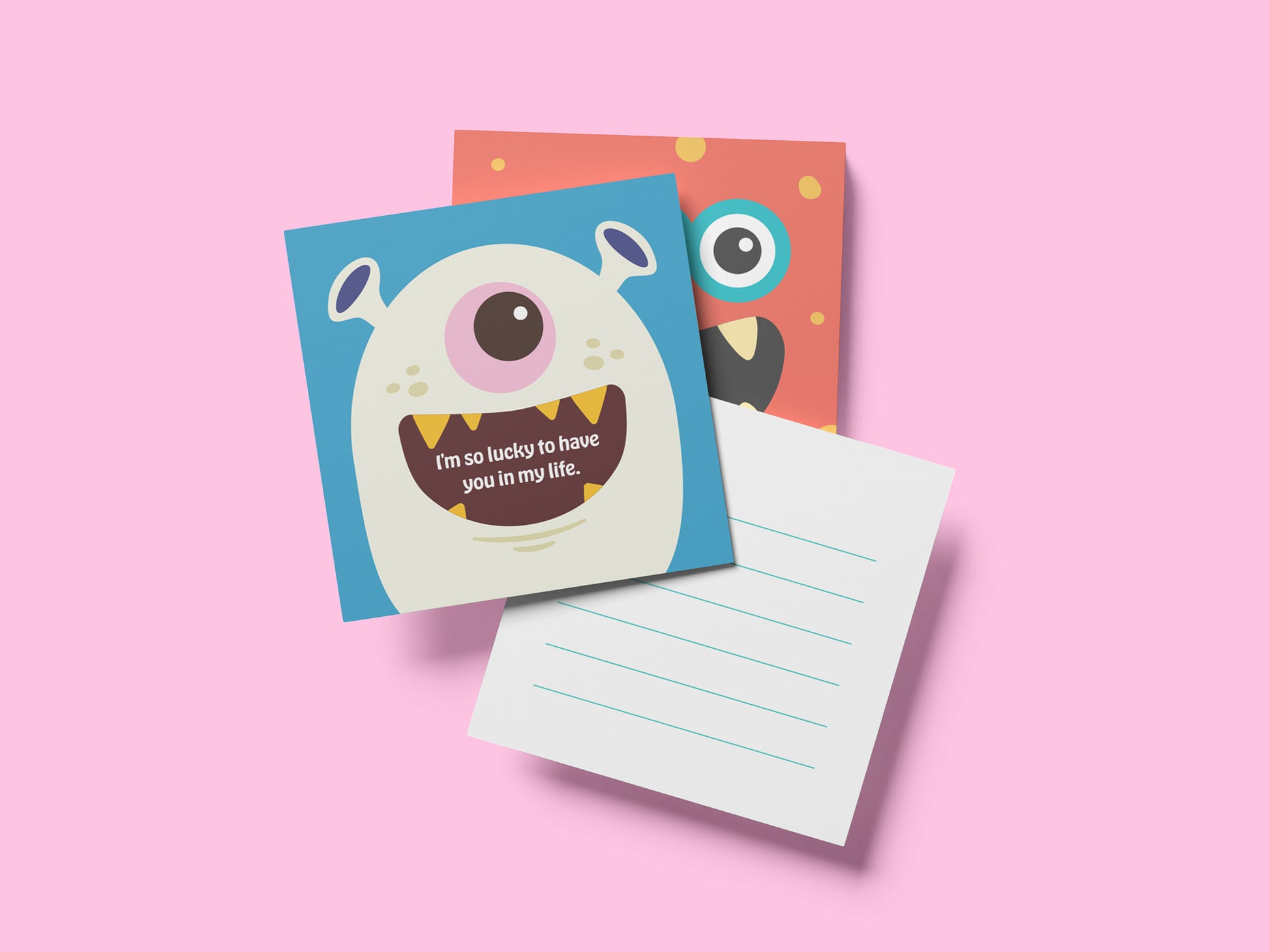 Two square monster lunch box note cards displayed on a pink background, showing playful monster designs on the front and lined backs for handwritten messages, handmade kids lunchbox notes for school lunches and backpacks.