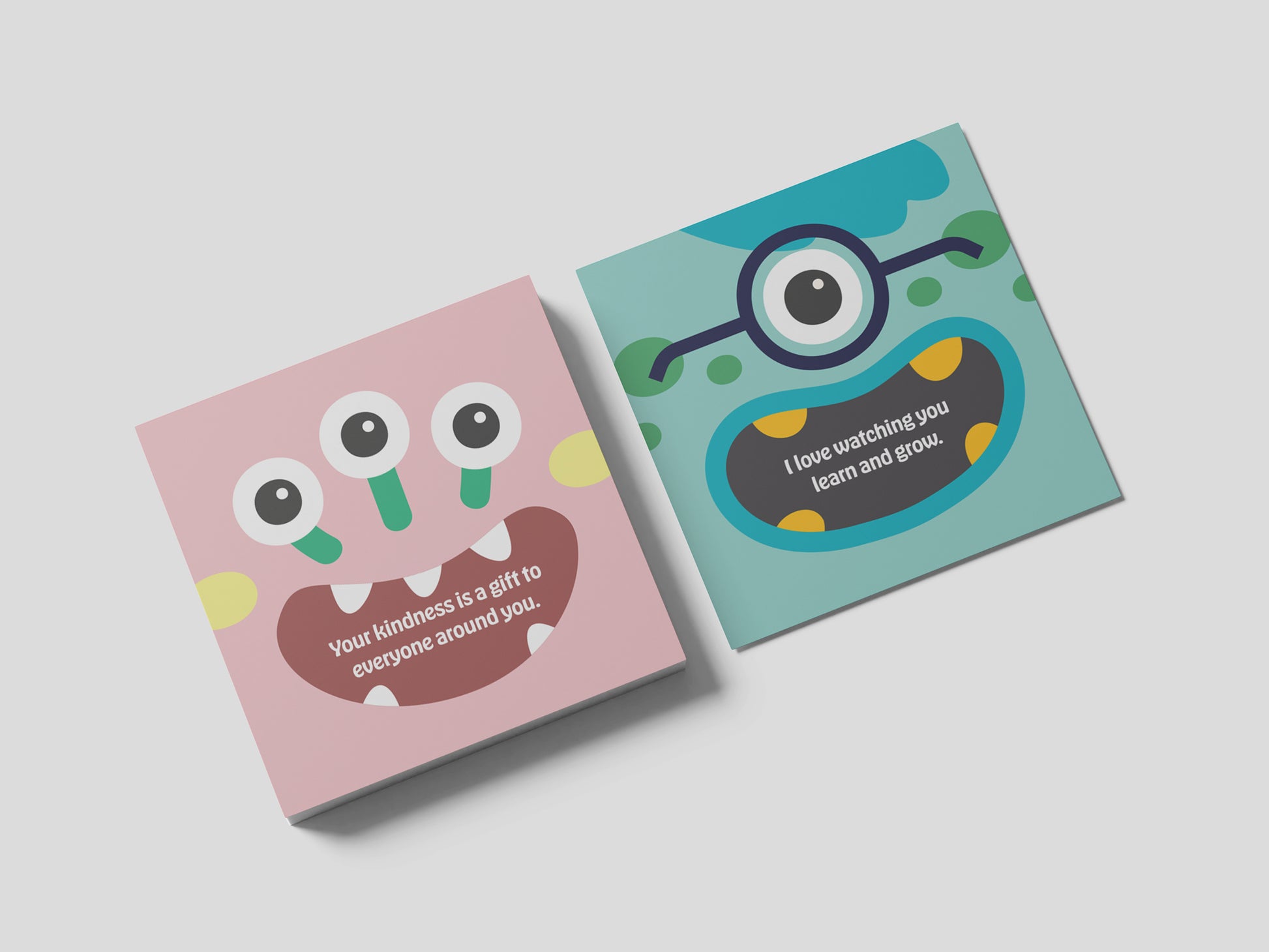 Two square monster lunch box note cards shown on a light gray background, featuring colorful monster faces with encouraging designs, handmade kids lunchbox notes created for school lunches, backpacks, and daily surprises.