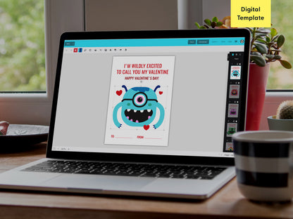 A laptop screen showing an editable template for a monster-themed Valentine card using the Templett platform. The design features a blue monster with a Valentine message in red. The workspace is set in a cozy, room with a potted plant and mug.