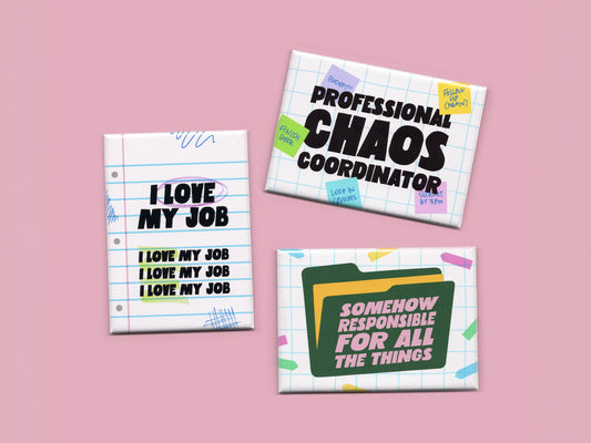 Three retro-inspired office humor magnets displayed on a soft pink background. The set includes a white lined-paper magnet reading “I Love My Job” in bold black text, a grid-paper magnet reading “Professional Chaos Coordinator” surrounded by colorful sticky note doodles, and a folder-inspired magnet reading “Somehow Responsible for All the Things” in pink lettering. The magnets feature playful office-themed graphics, pastel accents, and bold typography designed for hardworking coworkers and burnt-out profes