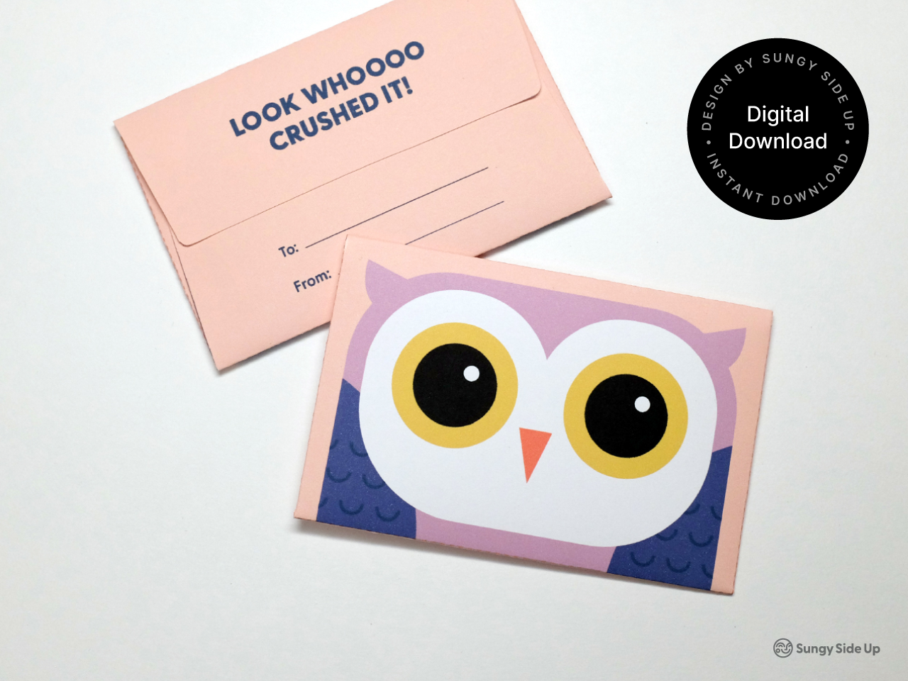 Hands folding a printable owl-themed gift card holder with pre-marked glue tabs visible. The design includes a large-eyed owl and printed To and From fields. Instructions are partially visible in the background. This digital product image highlights the interactive and handmade feel of the gift card holder, appealing to buyers who value creativity, education gifts, and easy at-home crafts.