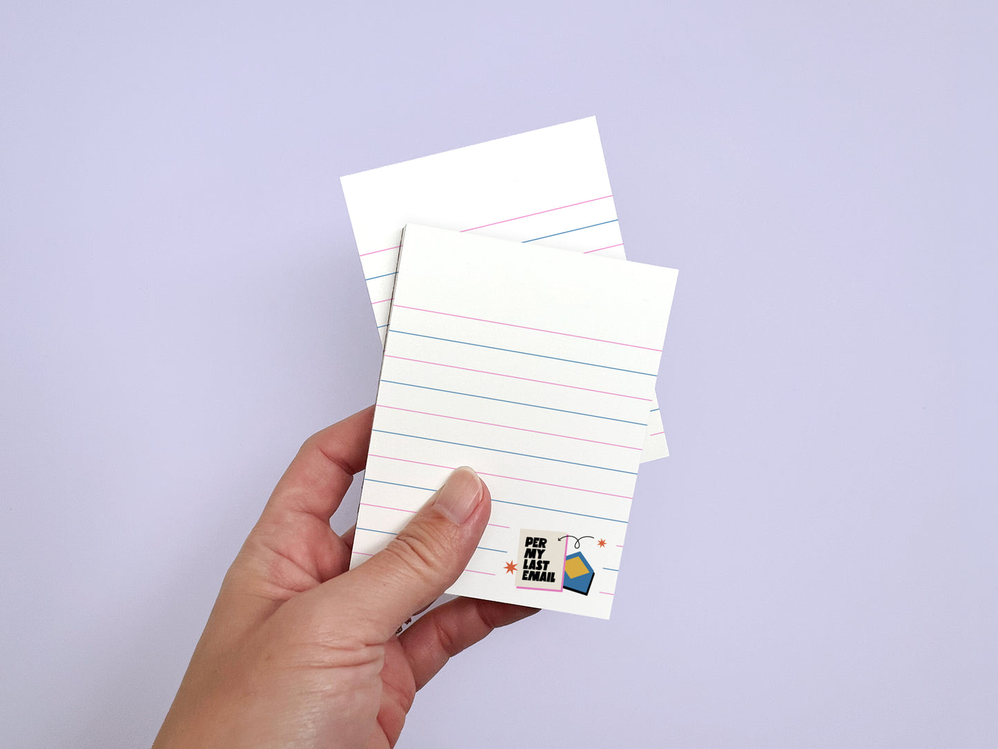 Hand holding two "Per My Last Email" 3x4 mini lined notepads with 50 tear-off sheets, funny office stationery for coworkers.