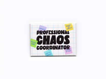 Rectangular white magnet with a light blue grid pattern and bold black text that reads “Professional Chaos Coordinator.” Small colorful sticky notes with handwritten reminders surround the text on the magnet.