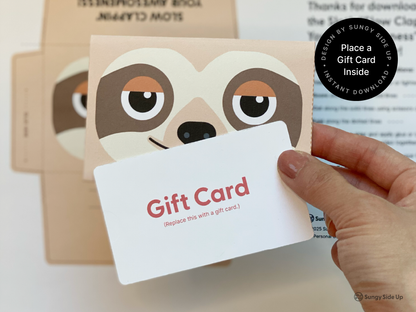 A printable sloth-themed gift card holder featuring a cute sloth face design, assembled by hand. The folded holder is shown holding a standard-sized gift card, perfect for adding a personal touch to gifts. The design includes cut and fold lines for easy assembly, with soft beige and brown tones that match the sloth’s coloring. Ideal for gifting during holidays, birthdays, or special events. Fun DIY project for kids and adults alike.