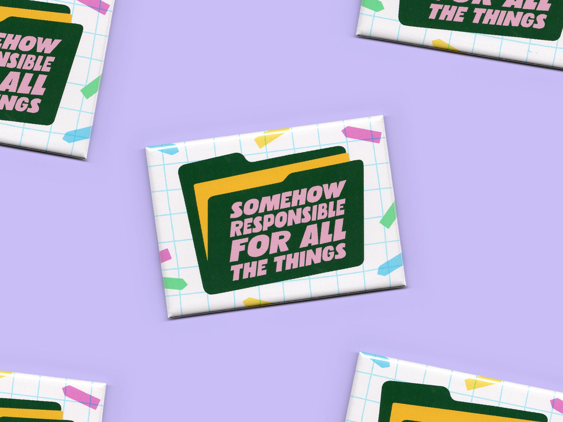 Multiple “Somehow Responsible for All the Things” magnets scattered across a light purple background. The magnets feature a white grid pattern, colorful confetti accents, and a dark green file folder graphic with pink text.