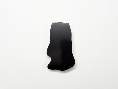 Back view of a handmade die-cut Bigfoot Halloween magnet, showing the smooth black magnetic surface. Durable fridge magnet perfect for holding notes or photos, ideal for Halloween décor, cryptid enthusiasts, and quirky woodland creature gifts.