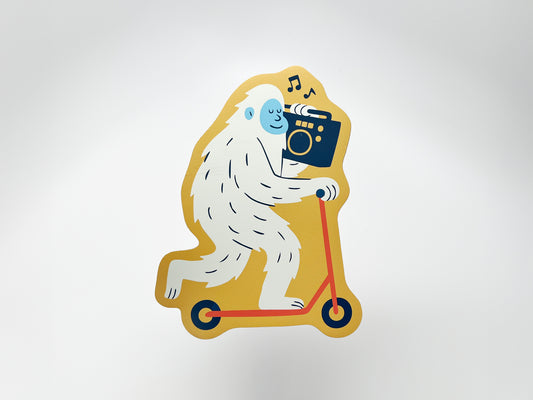 Die-cut magnet of a quirky white yeti riding a yellow scooter and carrying a black boombox with music notes above. Fun novelty fridge magnet gift for music lovers, scooter fans, and unique home or kitchen decor.
