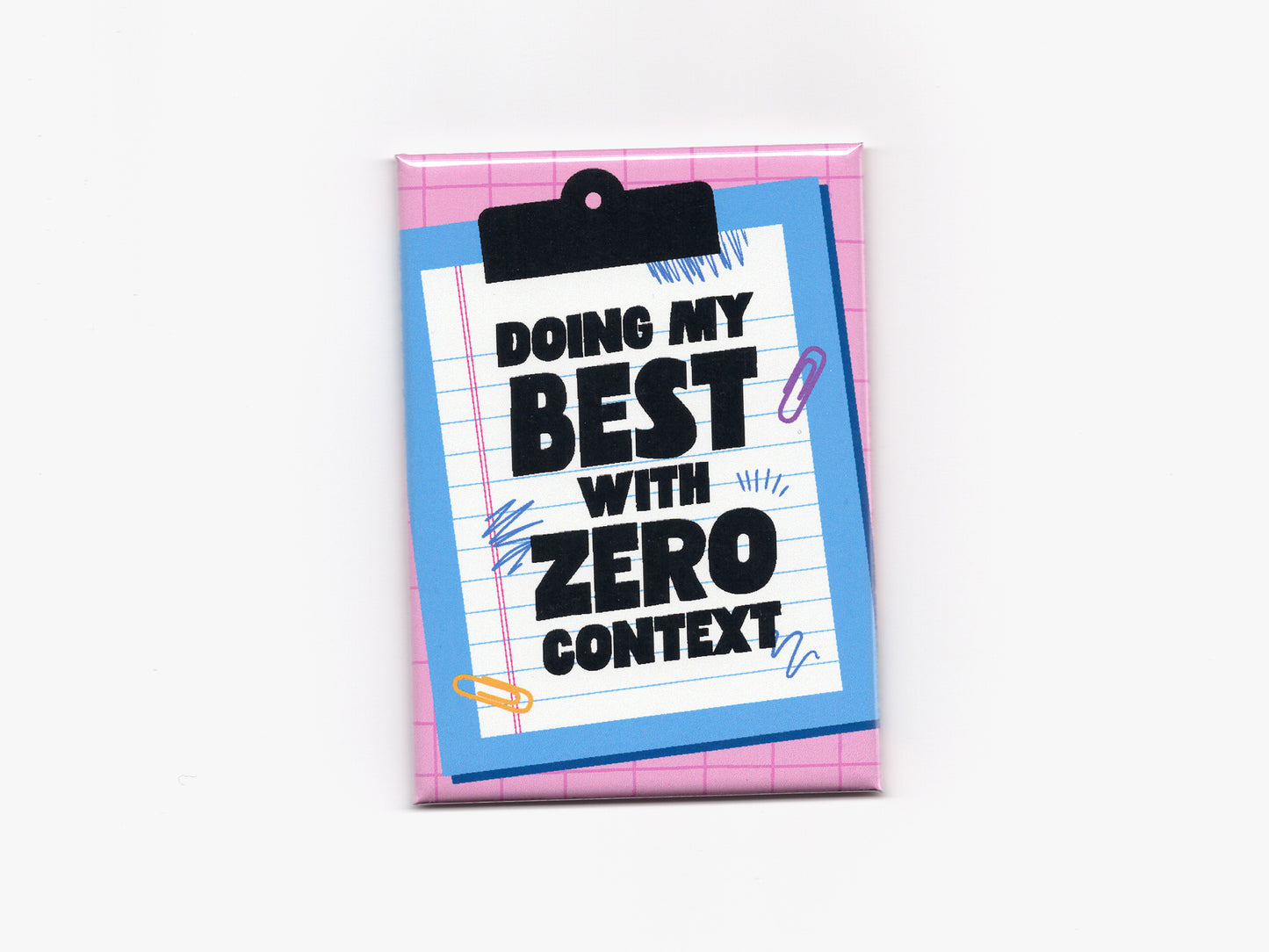 Rectangular magnet with a pink grid background and a blue clipboard illustration holding lined paper. Bold black text reads “Doing My Best With Zero Context,” with small doodle and paperclip accents around the design.