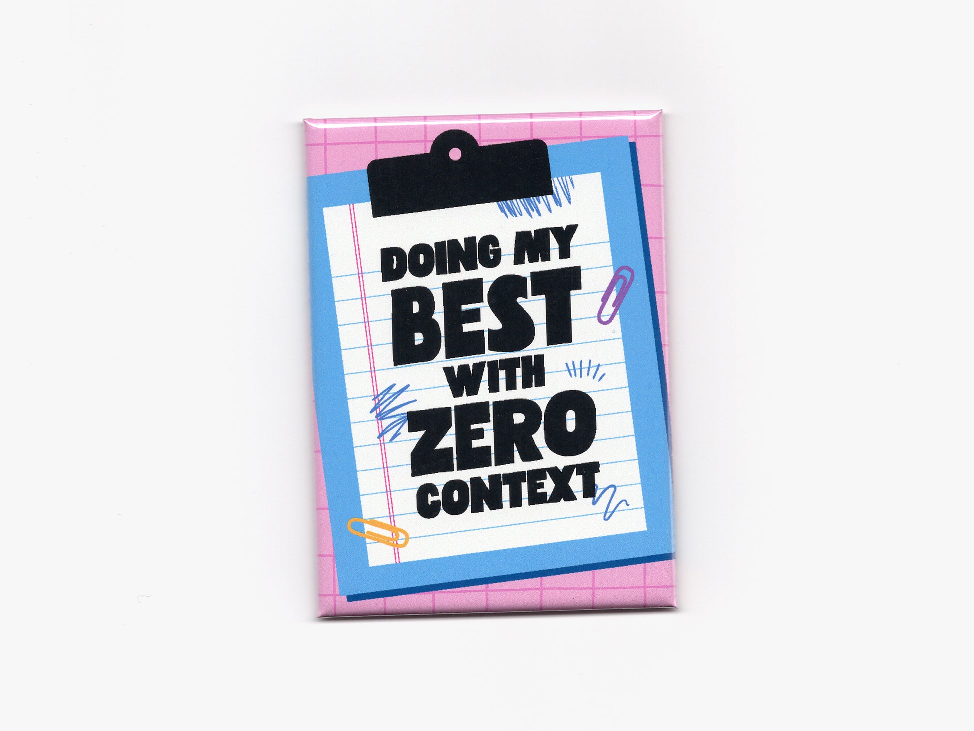 Rectangular magnet with a pink grid background and a blue clipboard illustration holding lined paper. Bold black text reads “Doing My Best With Zero Context,” with small doodle and paperclip accents around the design.